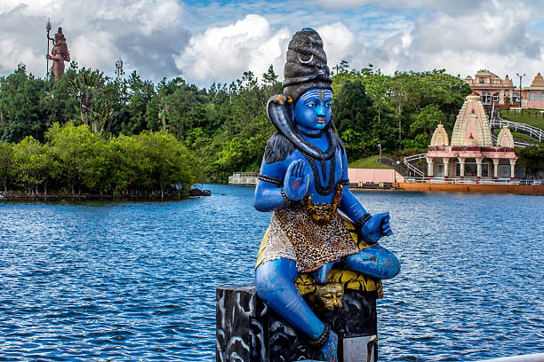 istock Blue Shiva statue and a temple 464920209
