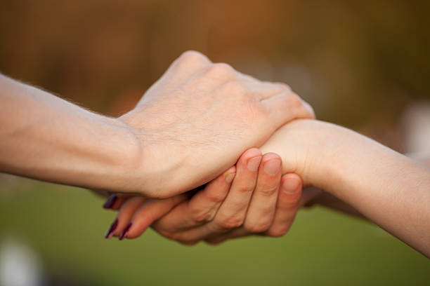 istock male and female hands 464921220