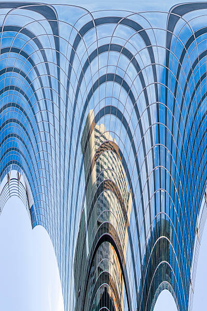 istock Abstract facade lines and glass reflection on modern building 464921254