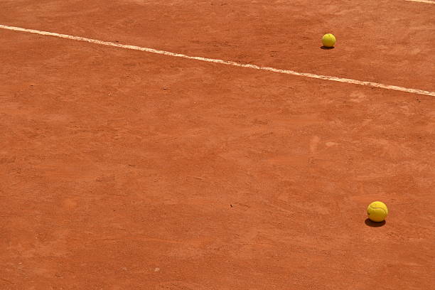 Clay court and tennis balls Clay court and tennis balls.  clay court stock pictures, royalty-free photos & images