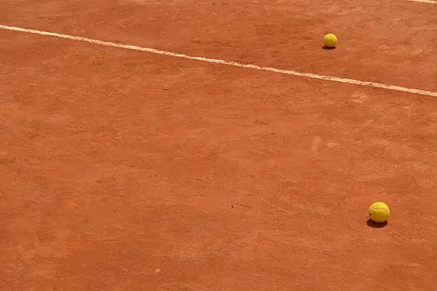 Clay court and tennis balls. 