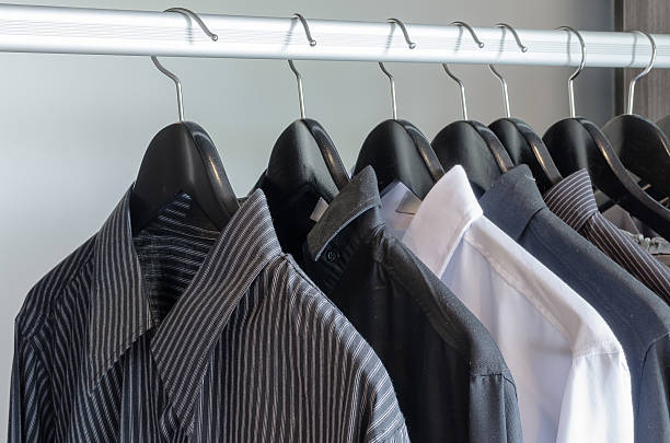 istock row of black and white shirts hanging 464925554