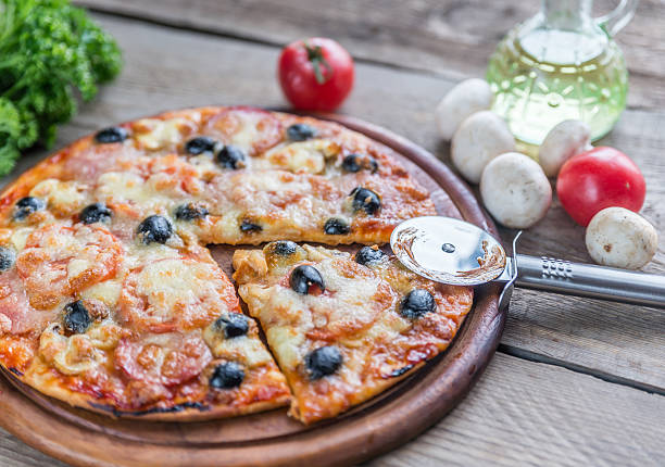 istock Cooked pizza on the wooden board 464927722