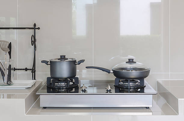 istock stainless pot on gas stove 464928352