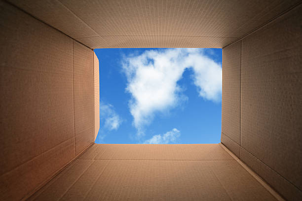 Thinking outside the box Inside a cardboard box concept for moving house, creativity or thinking outside the box inside the mind stock pictures, royalty-free photos & images