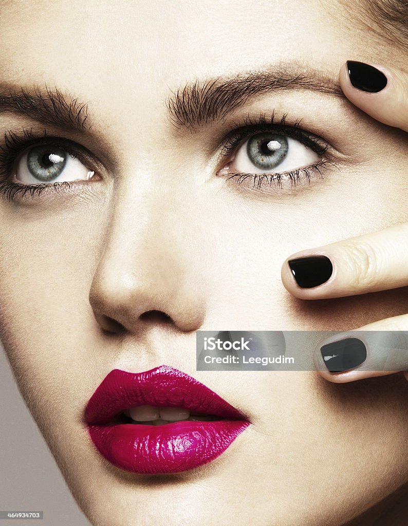 Close-up beauty portrait Close-up beauty portrait of beautiful model with bright make-up and manicure. Black nails, pink lips Adult Stock Photo