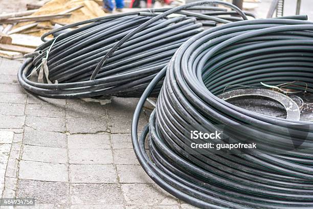 Hoses On The Street During Urban Renovation Stock Photo - Download Image Now - Hydraulic Platform, Snake, 2015