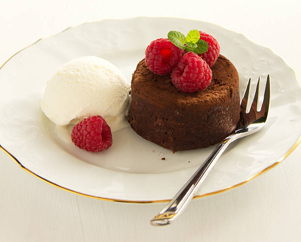 istock Chocolate fondant (pudding) with raspberries. 464935633