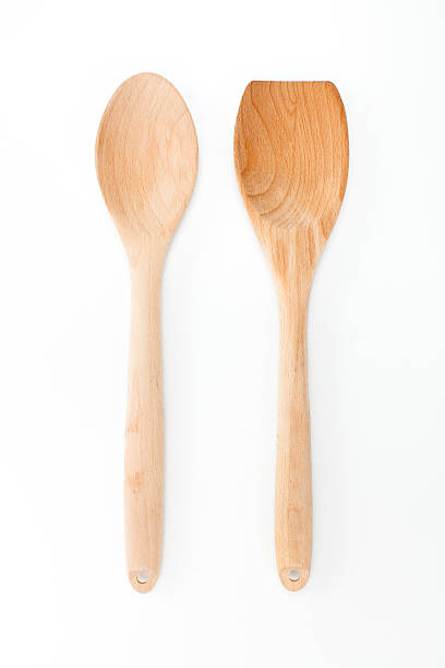 istock Wooden ladle and spatula on white background 464937896