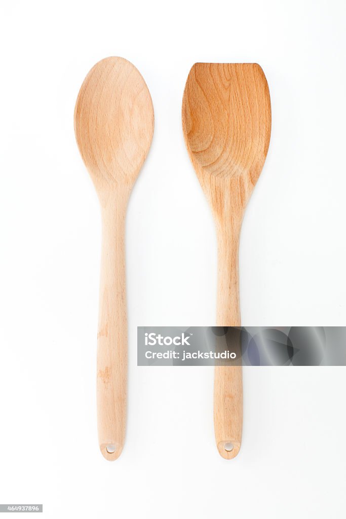 Wooden ladle and spatula on white background Wooden ladle and spatula on white background, kitchen utensils 2015 Stock Photo