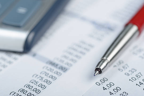 istock Pen and calculator on printed papers 464938712