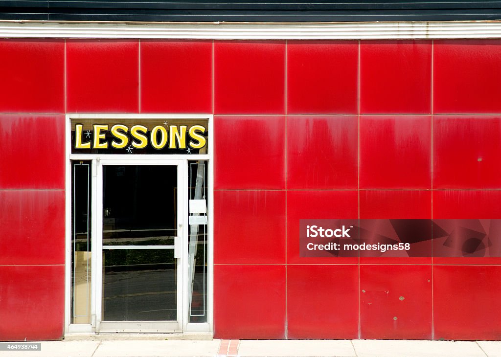 Red Tiled Storefront in a City Center A closeup view of a red tiled storefront that sold musical instruments and offered music lessons located in Guelph, Ontario. 2015 Stock Photo