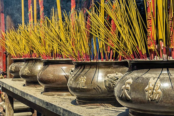 istock Incense Sticks Burning in a Brass Urn 464939916