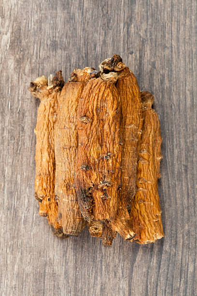 istock ginseng on the wood 464940306
