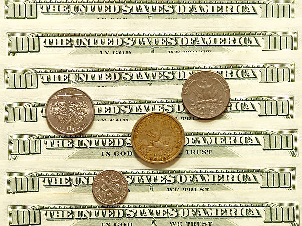 USA dollar banknotes and coins.