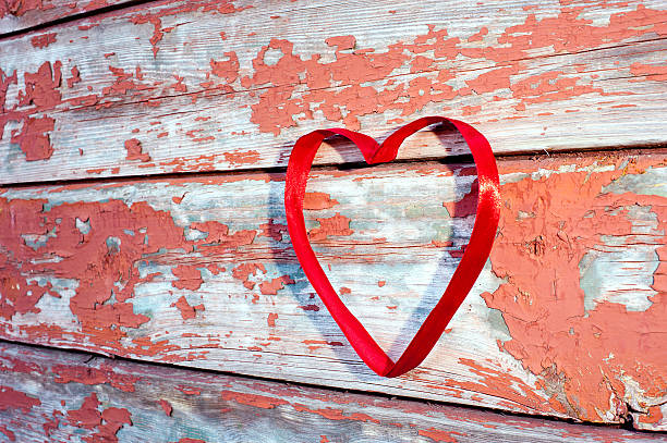 istock Red heart at cracked boards 464941751
