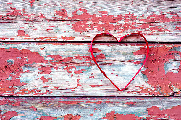 istock Red heart at cracked boards 464941869