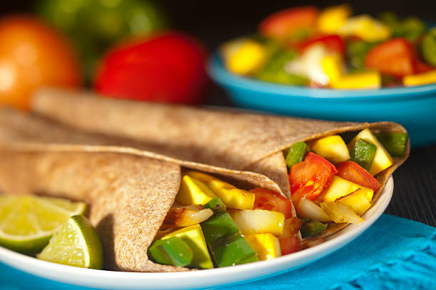 Grilled whole wheat vegetable fajitas Grilled vegetable fajitas in whole wheat tortillas with shallow depth of field wrap sandwich photos stock pictures, royalty-free photos & images