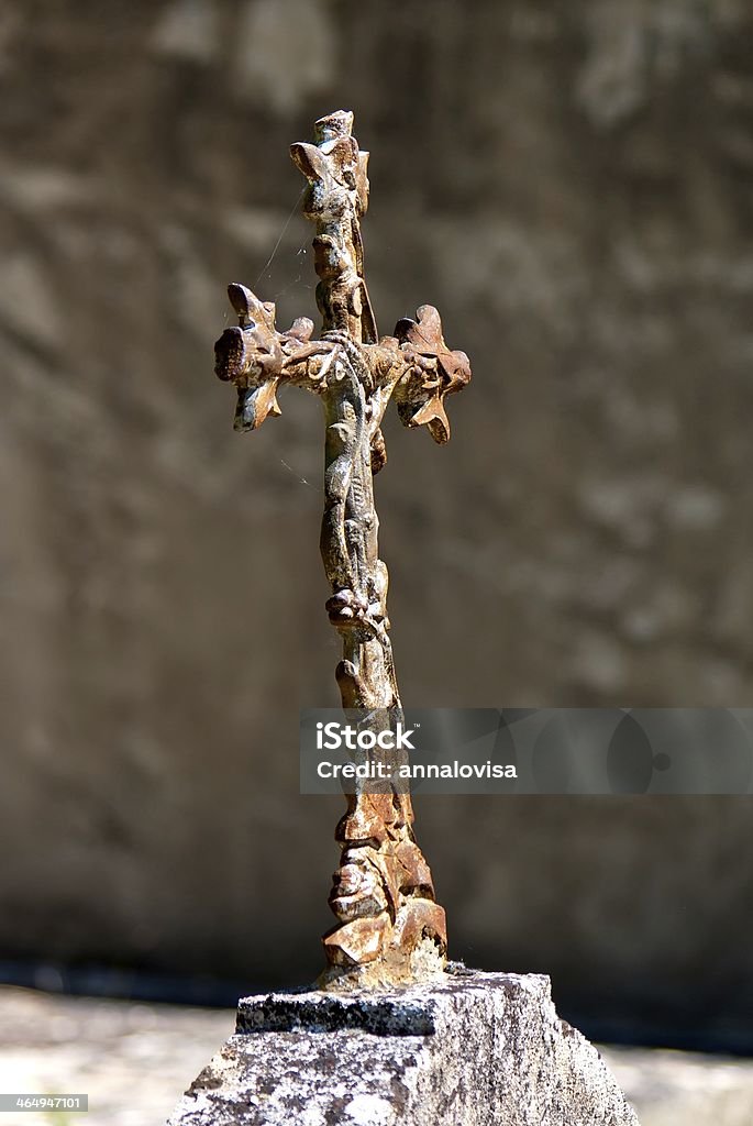 Iron cross Old religious iron cross on a gravestone at a cemetery in France. Architecture Stock Photo