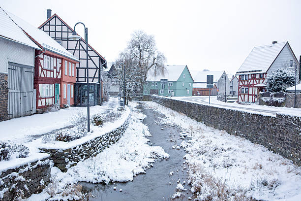 istock Winter landscape with snow in small German village. 464948943