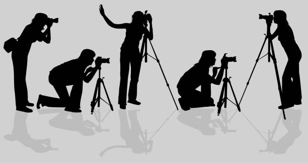 der fotograf - silhouette photographer photographing photograph stock-grafiken, -clipart, -cartoons und -symbole