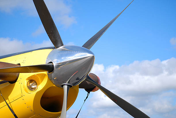 prop and spinner on yellow airplane stock photo