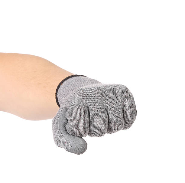 istock Strong male worker hand glove clenching fist. 464956813