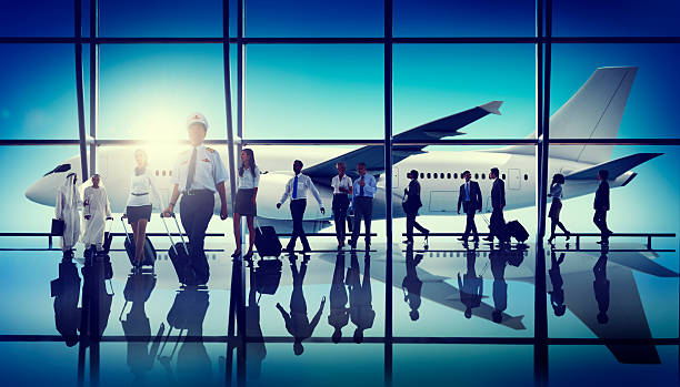 istock Stylized view of crew and passengers disembarking a plane 464959540
