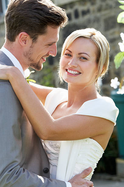 istock Romantic Bride And Groom Embracing Outdoors 464959983