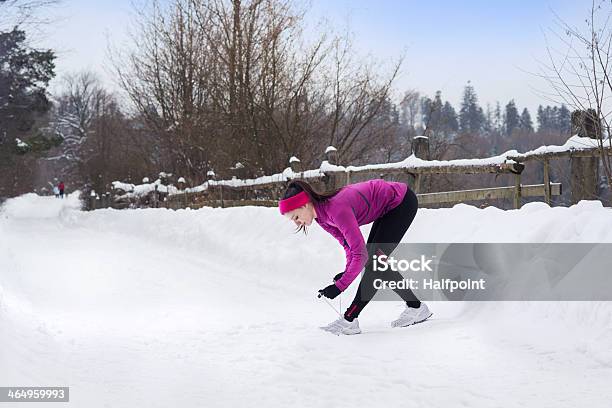 Woman Running In Winter Stock Photo - Download Image Now - Active Lifestyle, Activity, Adult