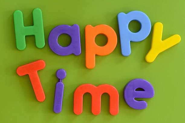 istock Close up of Happy Time words in colorful plastic letters 464960077