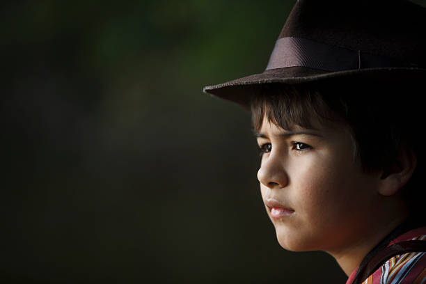 istock Boy with adventurer hat watching the scenery . 464961916