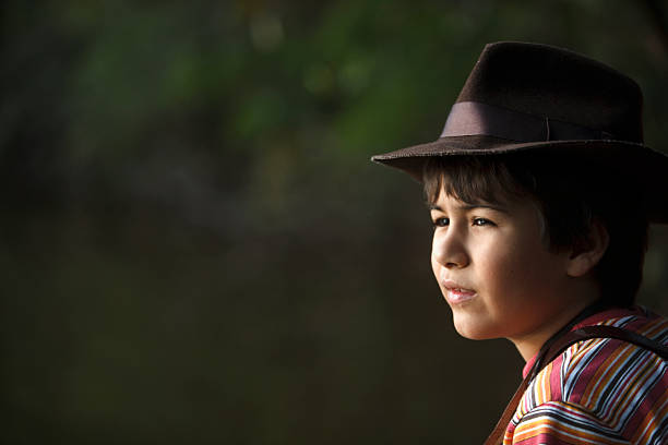 istock Boy with adventurer hat watching the scenery . 464961932