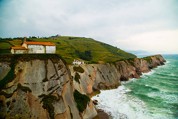 istock Church on a rock by the ocean 464962575