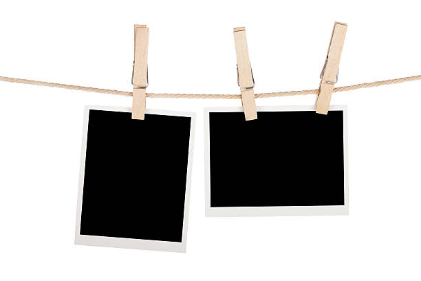 istock Blank photos hanging on clothesline 464962719