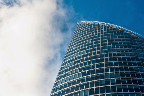 part of modern business glass building on blue sky background