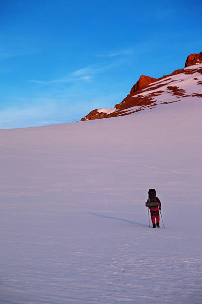 istock Hiker in sunrise mountains 464968537
