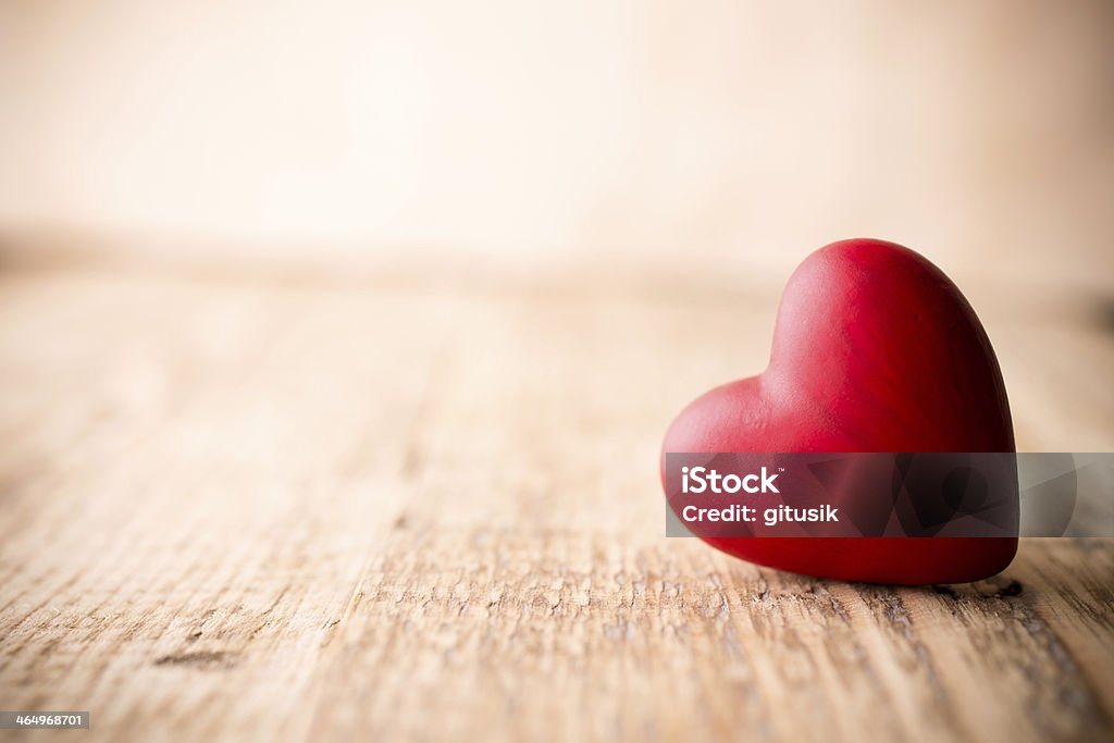 Red heart. Red heart-shaped candy on a wooden background. Heart Shape Stock Photo