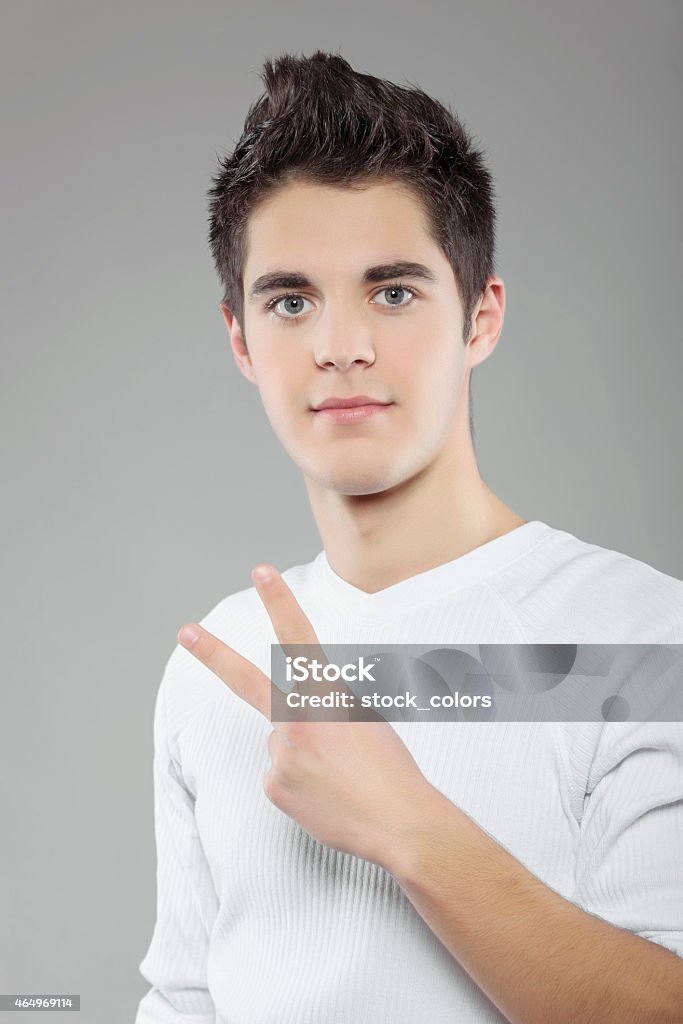 peace sign teenager portrait showing peace sign. 20-24 Years Stock Photo