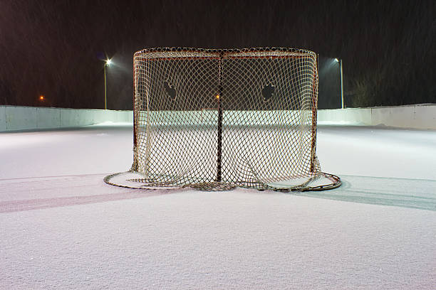 istock Hockey net on outdoor rink 464969535