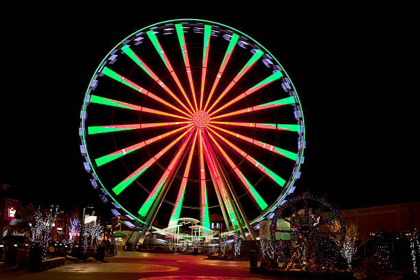 Ferris Wheel in Gatlinburg, Tennessee during the Christmas Holidays Ferris Wheel in Gatlinburg, Tennessee during the Christmas Holidays taken at night with long exposure gatlinburg stock pictures, royalty-free photos & images