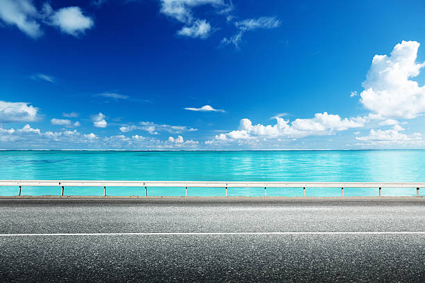 istock asphalt road and sea 464969610