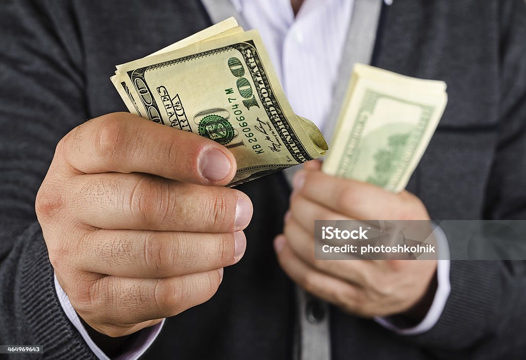 some of the money man gives some of the money, closeup Adult Stock Photo