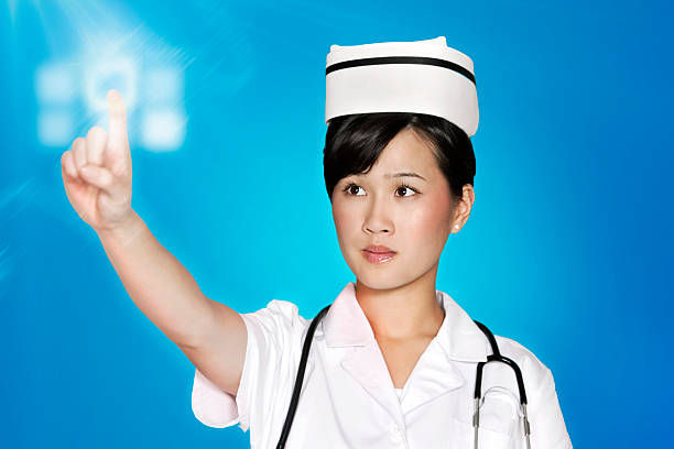 istock Female nurse using futuristic touch screen over blue background 464970885