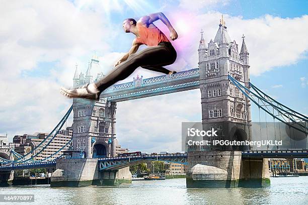 Male Athlete Hurdling Tower Bridge Stock Photo - Download Image Now - Hurdling - Track Event, Hurdle, 30-39 Years