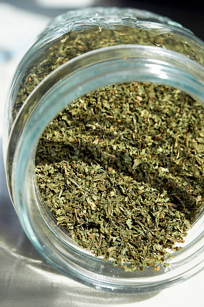 istock Dried green tea in bottle 464971852