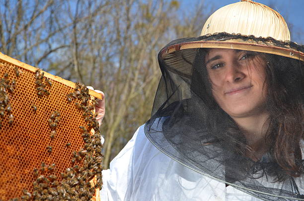 istock young girl beekeeper in apiary 464974878