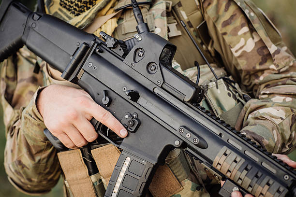 istock weapons in the hands of a soldier ready for battle 464975018