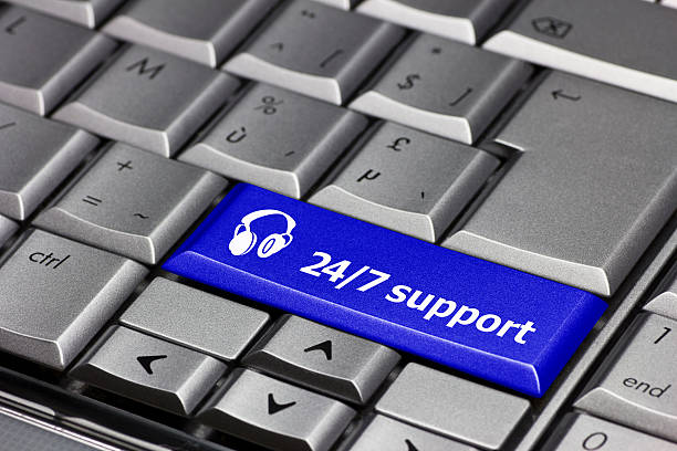 Computer key blue - 24/7 support with headphone icon stock photo