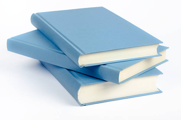 tre libri blu su sfondo bianco - hardcover book education single word horizontal foto e immagini stock